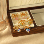 titanium-steel-bowknot-heart-shape-earrings