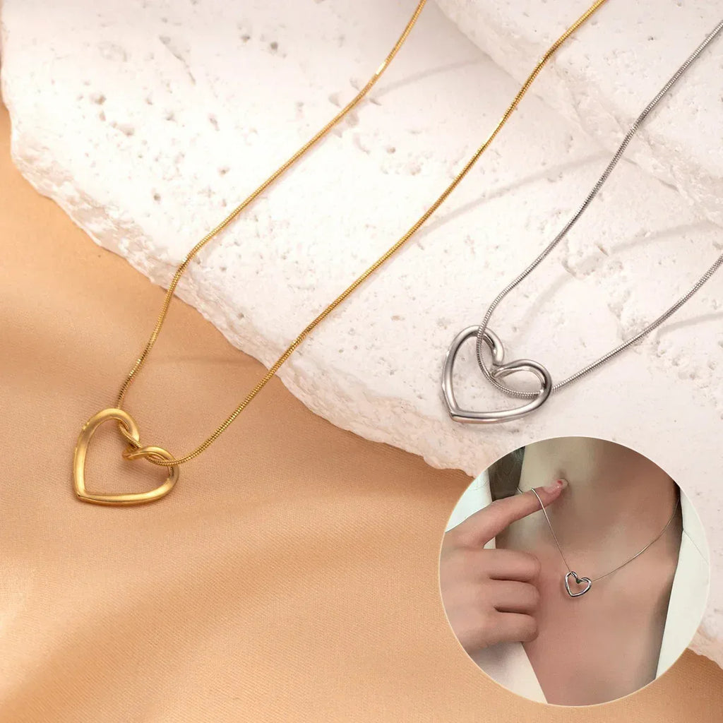 stainless-steel-twist-hollow-heart-pendant - Viexta