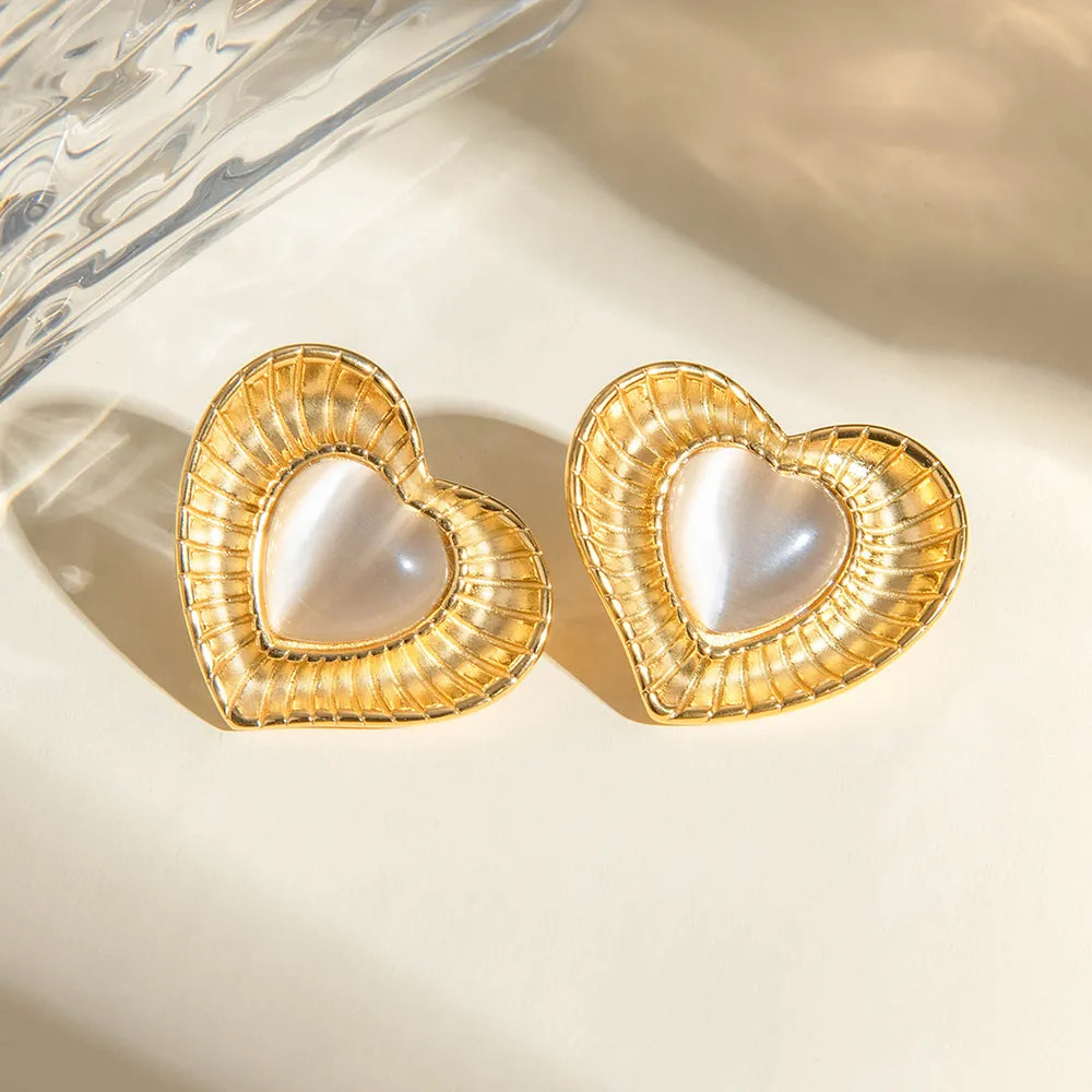 White cat eye stone earrings