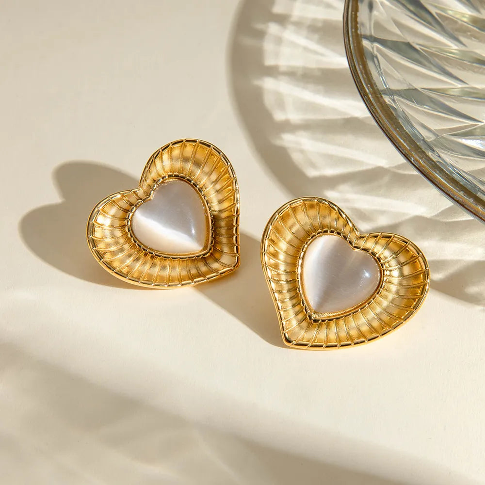 White cat eye stone earrings