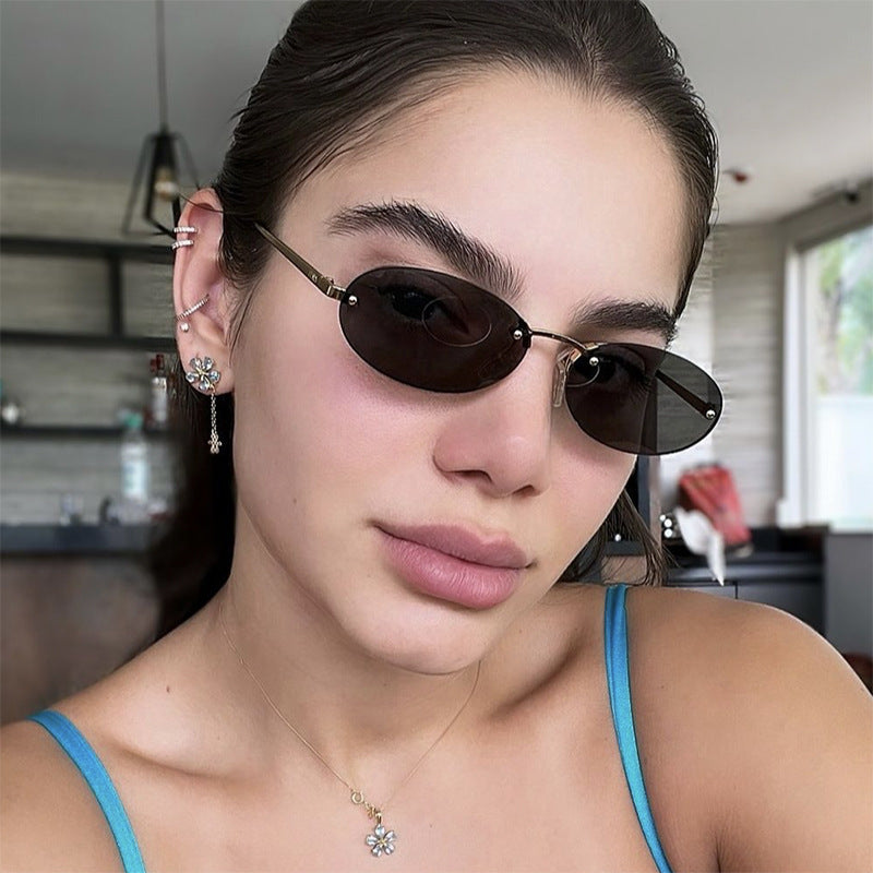 Elliptical frameless sunglasses with rivets, new fashion sunglasses, trendy street photography sunglasses for women