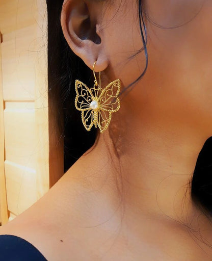 Butterfly brass earring