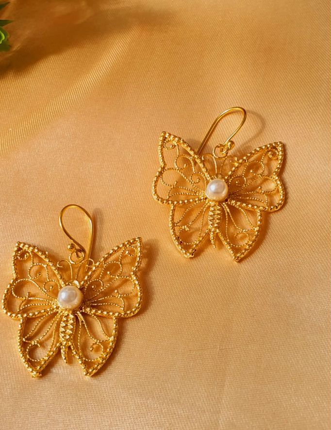 Butterfly brass earring