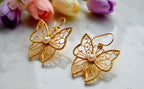 Butterfly brass earring