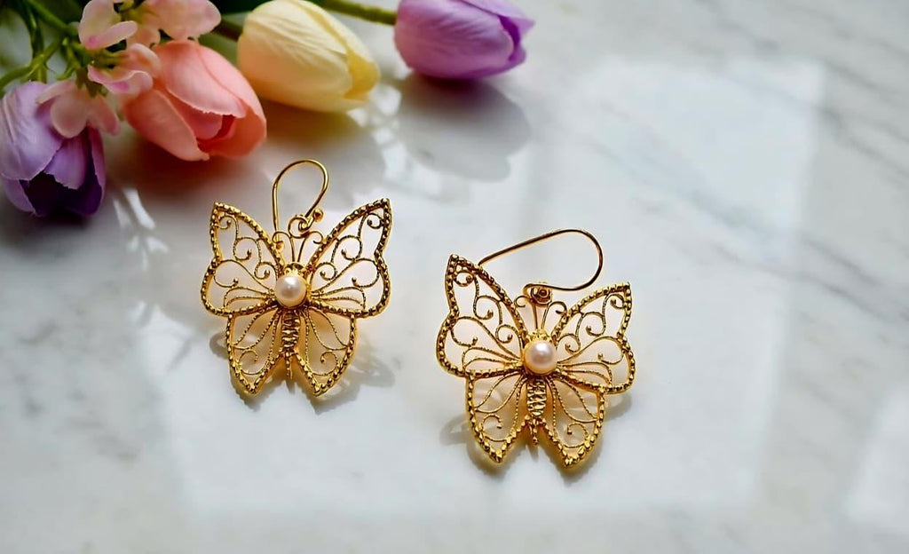 Butterfly brass earring