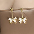 Tassel Drip Oil Bow Earrings - Viexta