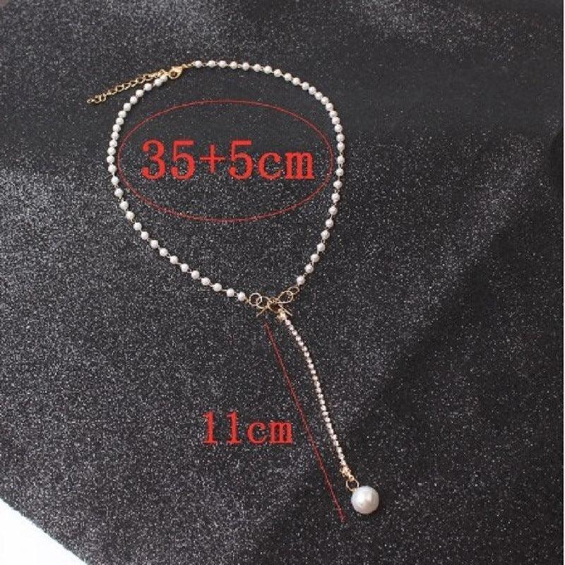 graceful-bow-long-pearl-tassel-pendant-necklace - Viexta